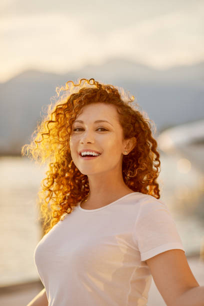 istock Red head Woman portrait on the beach 1269741219