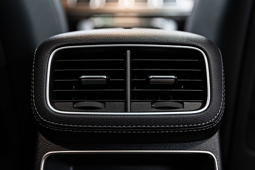 Car air vents and air conditioning. Modern car interior.