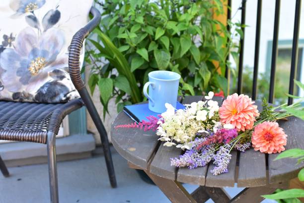 istock Outdoor patio seating for relaxing or working from home on sheltered small space deck during summer afternoon 1269745663