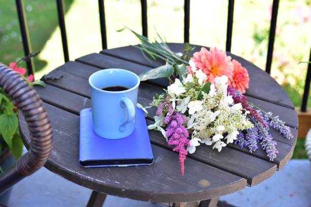istock Outdoor patio seating for relaxing or working from home on sheltered small space deck during summer afternoon 1269745671
