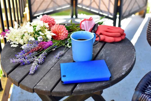 istock Outdoor patio seating for relaxing or working from home on sheltered small space deck during summer afternoon 1269745674
