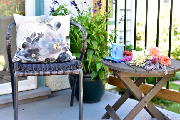 istock Outdoor patio seating for relaxing or working from home on sheltered small space deck during summer afternoon 1269746915
