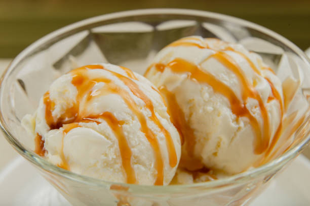 istock White ice cream in a glass glass with caramel 1269752720
