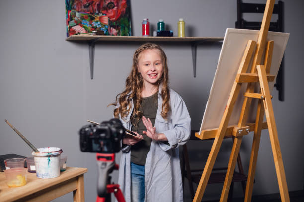 istock a young blogger girl at home leads a remote masterclass on drawing pictures during quarantine 1269755456