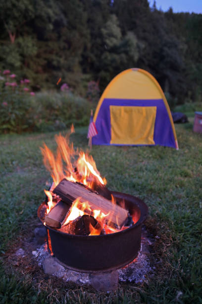 istock Burning fire in an iron ring and tent. 1269755908