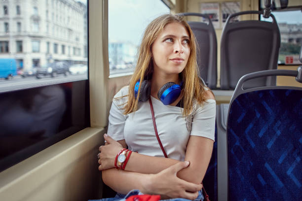 istock Attractive young woman sits in trolleybus. 1269757970