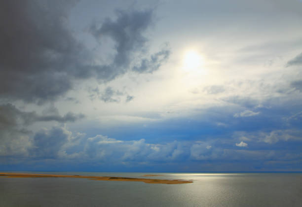 Mystical sunrise over the ocean . Island in the sunlight