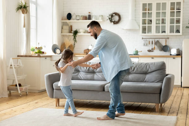 istock Happy father dancing having fun with little daughter. 1269761477