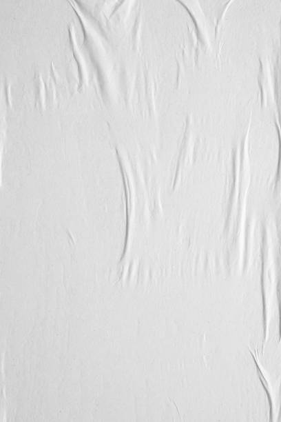 istock Blank white crumpled and creased paper poster texture background 1269761579