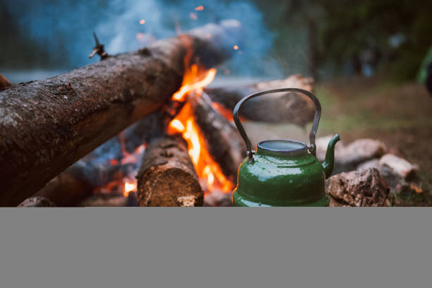 Morning tea made on a camp fire at the wild camping area at sunrise