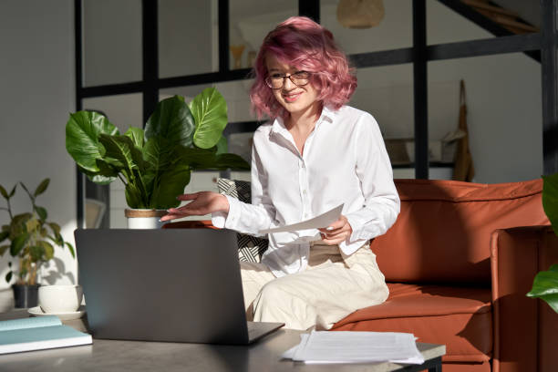 istock Smiling woman teacher videoconferencing by webcam conference on laptop. 1269762955