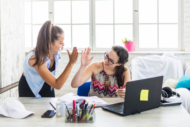istock Two female students are working together on a project 1269763350