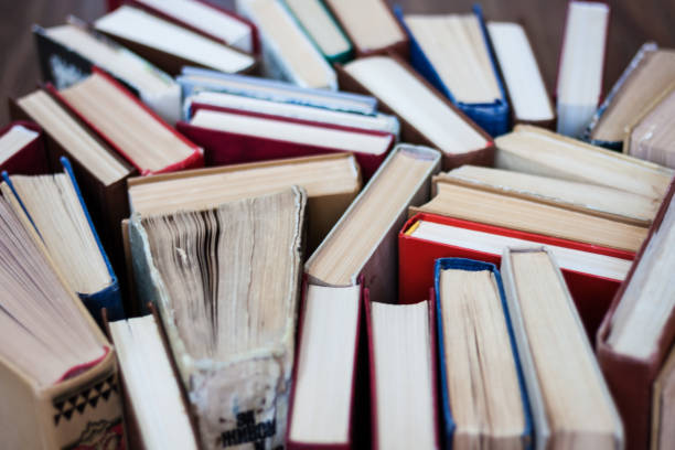 istock stack of old book, education concept background, many books piles with copy space for text 1269763509