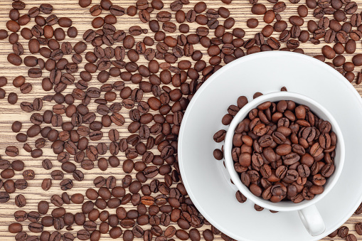 white chapel with coffee beans on the background of scattered coffee beans