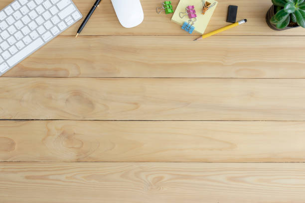 istock Desk top view, Wood table with office supplies. 1269769402