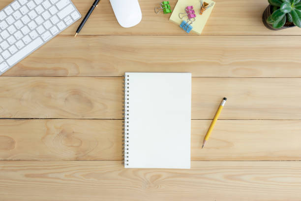 istock Desk top view, Wood table with office supplies. 1269769425