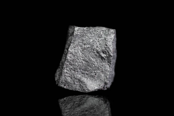 istock Magnetit ore, raw rock on black background, mining and geology, magnetic minerals 1269770295