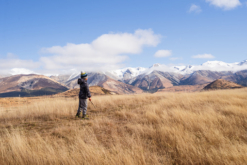 Enjoying outdoors at Castle Hill basin, a low depression bounded by the Craigieburn and Torlesse Ranges, Canterbury region of South Island, New Zealand.