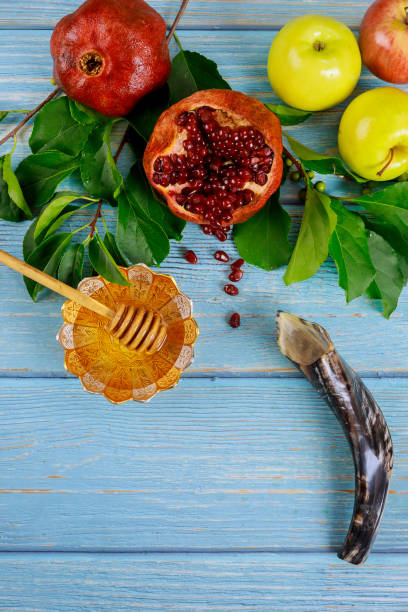 istock Pomegranate, apples and honey for Rosh Hashanah with horn. 1269771986