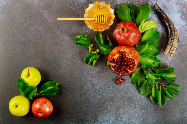 istock Apples, pomegranate and honey for Rosh Hashanah with horn. 1269771993