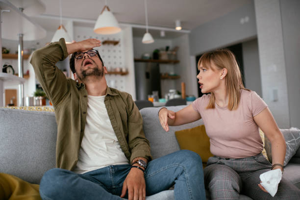istock Husband and wife are arguing on the couch. 1269774389
