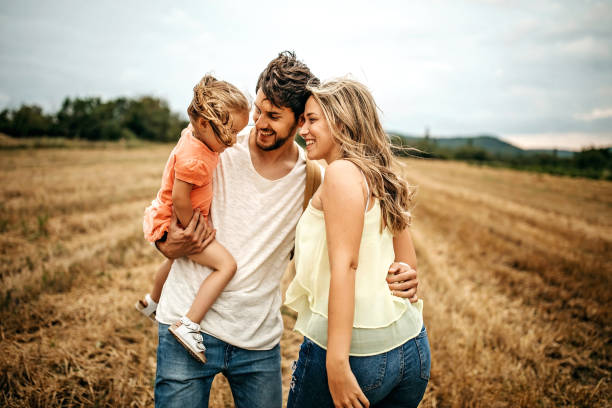 istock Family sharing love in sunset 1269777990