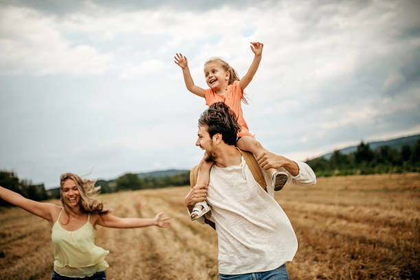 istock Family sharing love in sunset 1269777997