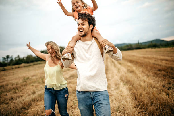 istock Family sharing love in sunset 1269778573