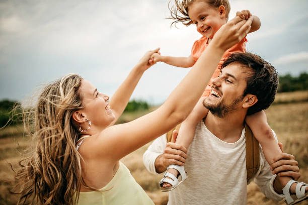 istock Family sharing love in sunset 1269778781