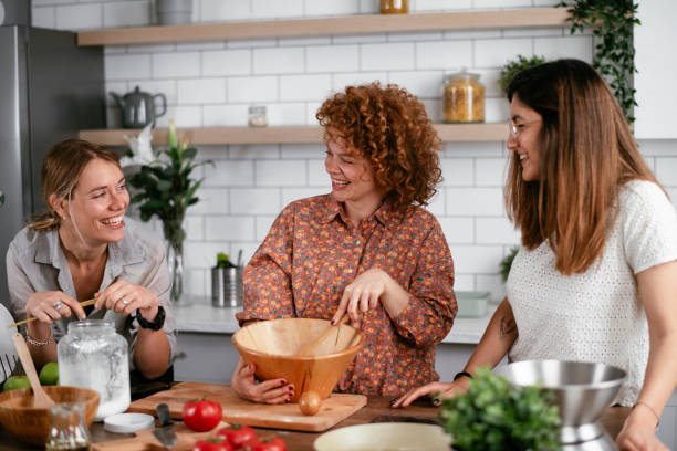 istock Sisters preparing delicious food at home. 1269778917