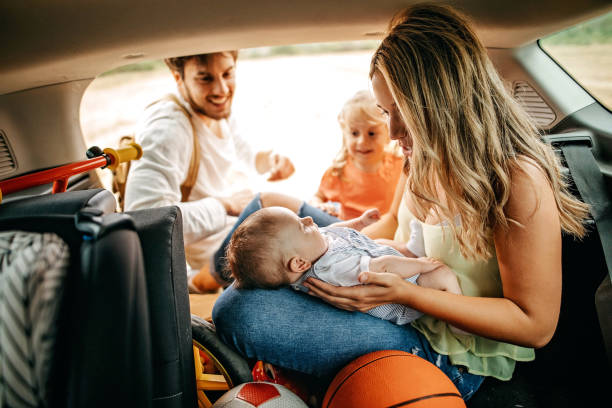 istock Parents with kids going to picnic with car 1269778946