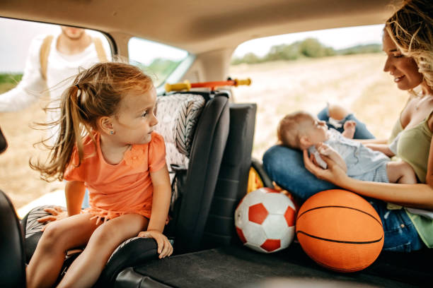 istock Parents with kids going to picnic with car 1269778990