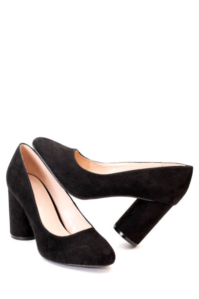 istock Women's black shoes with heels on a white background 1269781458
