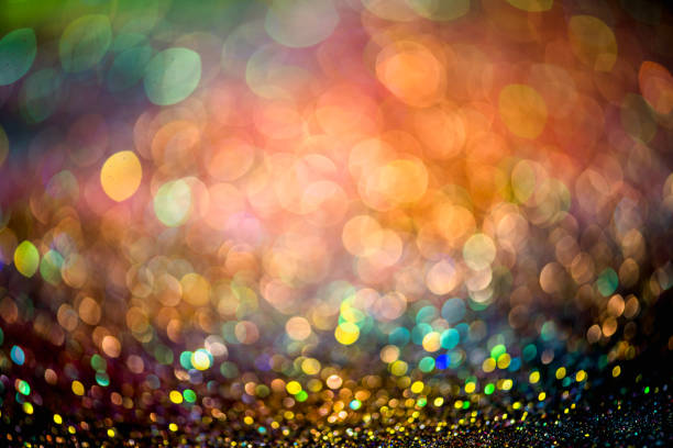 istock bokeh effect glitter colorful blurred abstract background for birthday, anniversary, wedding, new year eve or Christmas 1269781594