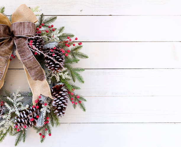istock Christmas Wreath on a White Wood Background 1269782481