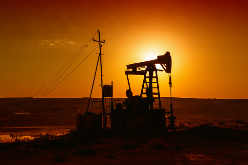 Oil pumps silhouette at colorful sunset
