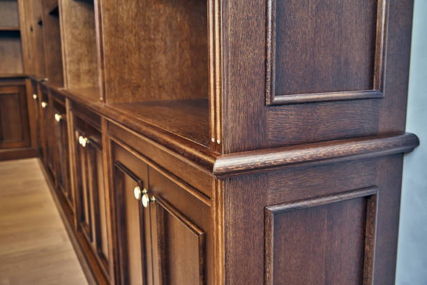 istock Wooden bookcase with empty shelves in home library 1269786034