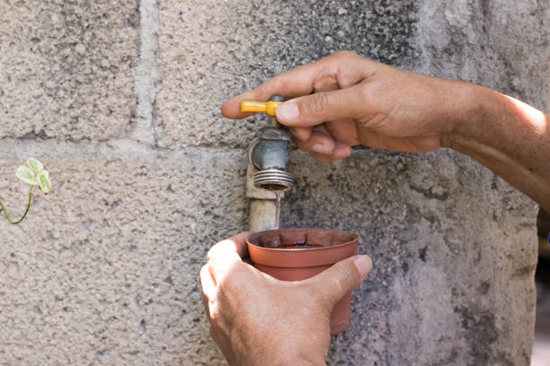 istock Woman hands opening a water faucet 1269787079