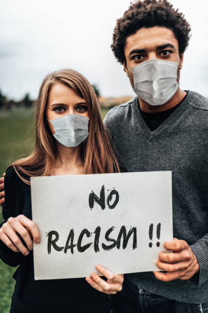 couple holding a board during a protest man holding a board during a protest i cant breathe photos stock pictures, royalty-free photos & images