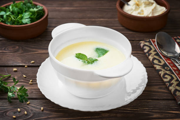 Homemade Turkish yogurt soup (yayla soup), seasonal, summer soup, served hot or cold. Healthy wholesome food, the first starter dish. Close up stock photo