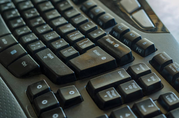 Close-up of black computer keyboard with Cyrillic alphabet. Remote work or homeschooling concept. Selective focus.