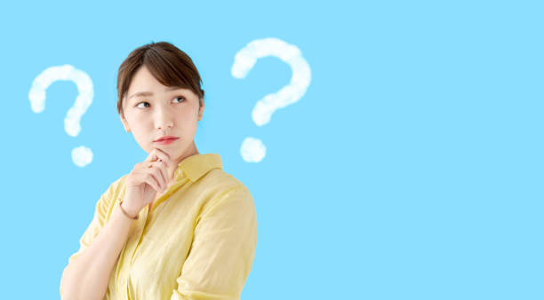 istock Thinking asian woman. Question mark. 1269799025