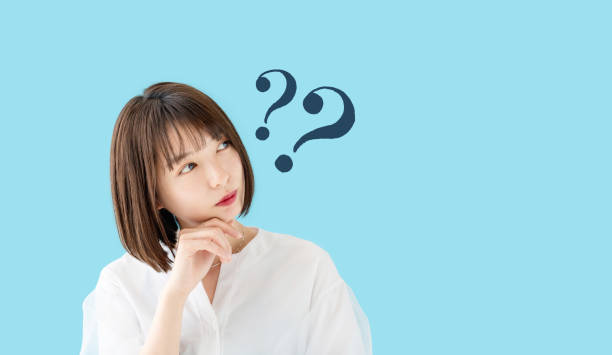 istock Young asian woman having questions. 1269799261