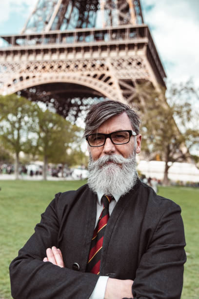 istock caucasian hipster man under the tour eiffel 1269805058