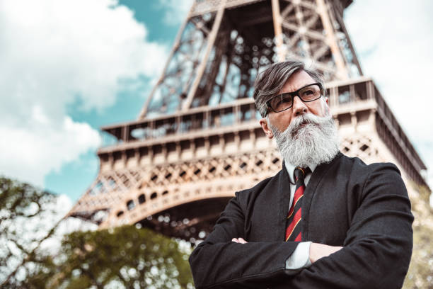 istock caucasian hipster man under the tour eiffel 1269805547