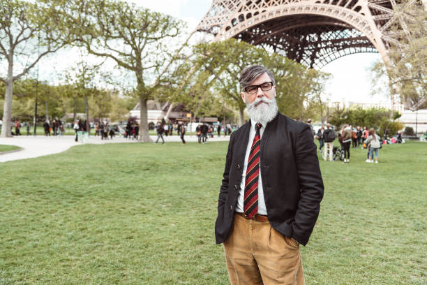 istock caucasian hipster man under the tour eiffel 1269806182