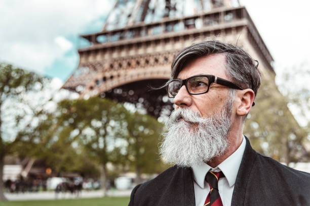 istock caucasian hipster man under the tour eiffel 1269806214