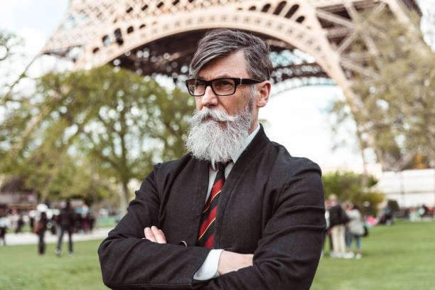 istock caucasian hipster man under the tour eiffel 1269806306