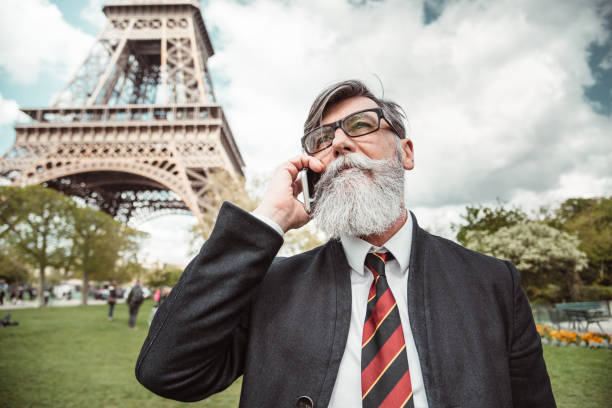 istock caucasian hipster man under the tour eiffel 1269806341