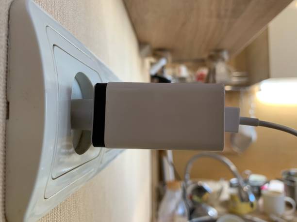 istock Side view. Charger with 3 USB ports in wall socket. 1269807945